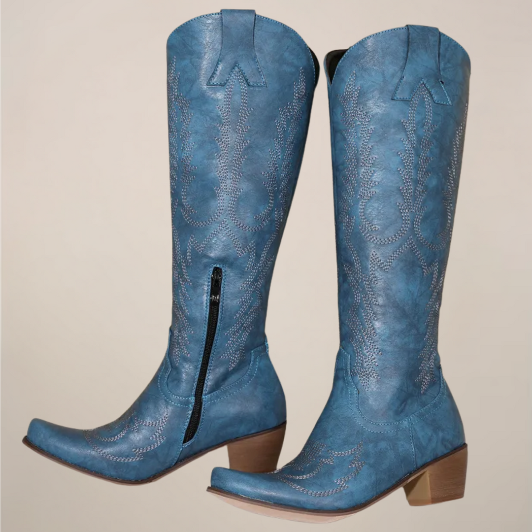 Statement women's knee-high Western cowboy boots. Elegant pull-on design with decorative embroidery & a fashionable block heel.