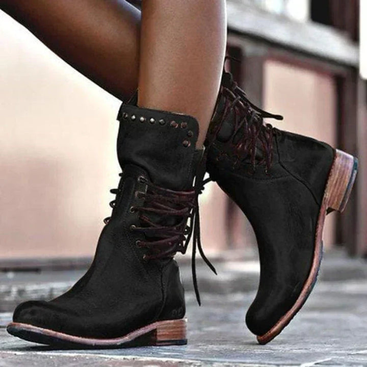 Chic women's lace-up ankle boots with sturdy laces, offering comfortable fit & versatile everyday style.