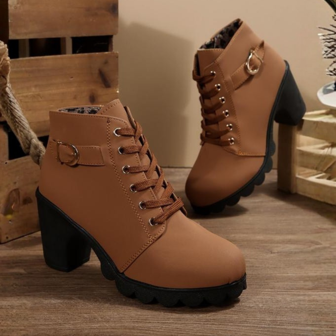 Women's black lace-up ankle boots featuring a sturdy block heel and elegant design for both casual & dressy wear.