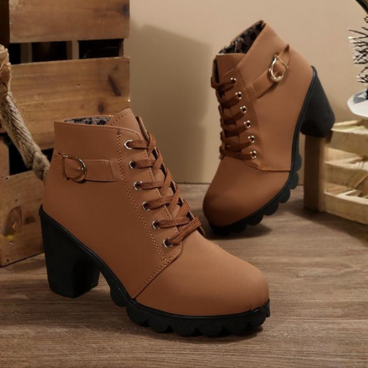 Women's black lace-up ankle boots featuring a sturdy block heel and elegant design for both casual & dressy wear.