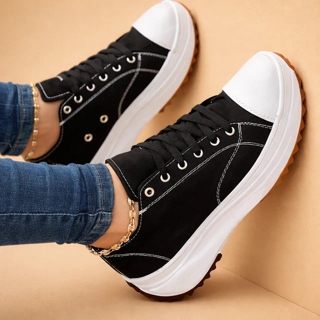 Fashionable women's lace-up sneakers, perfect for everyday comfort. Low-top casual footwear.