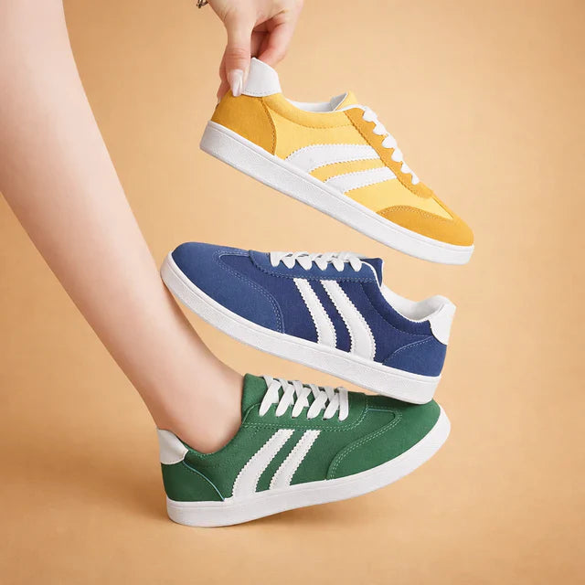 Stylish women's lace-up sneakers in white, perfect for everyday comfort & versatile casual wear.