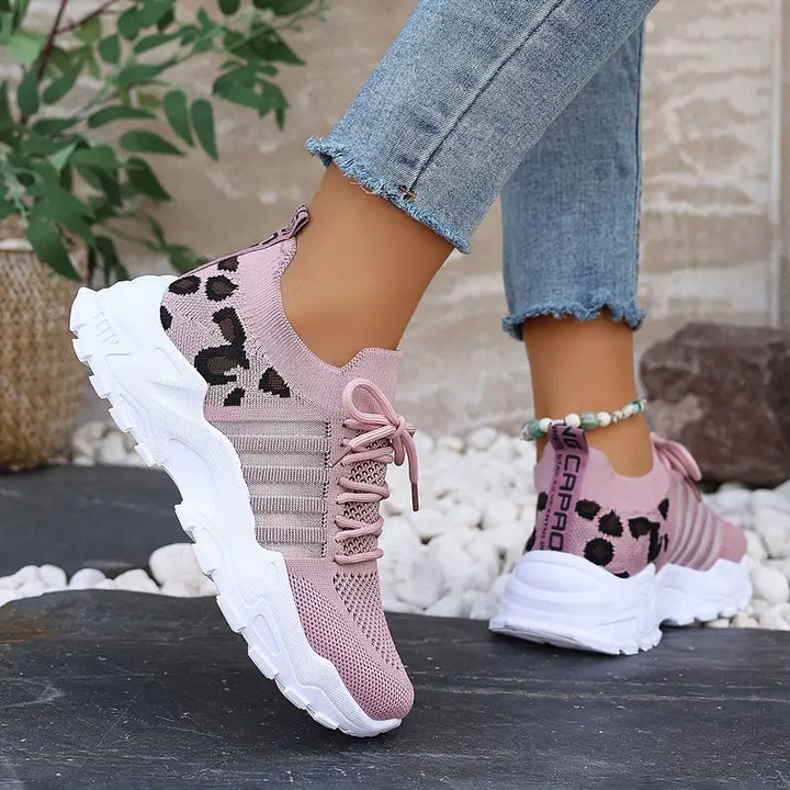 Fashionable women's low-top walking shoes featuring a chic patterned texture and comfortable lug sole.