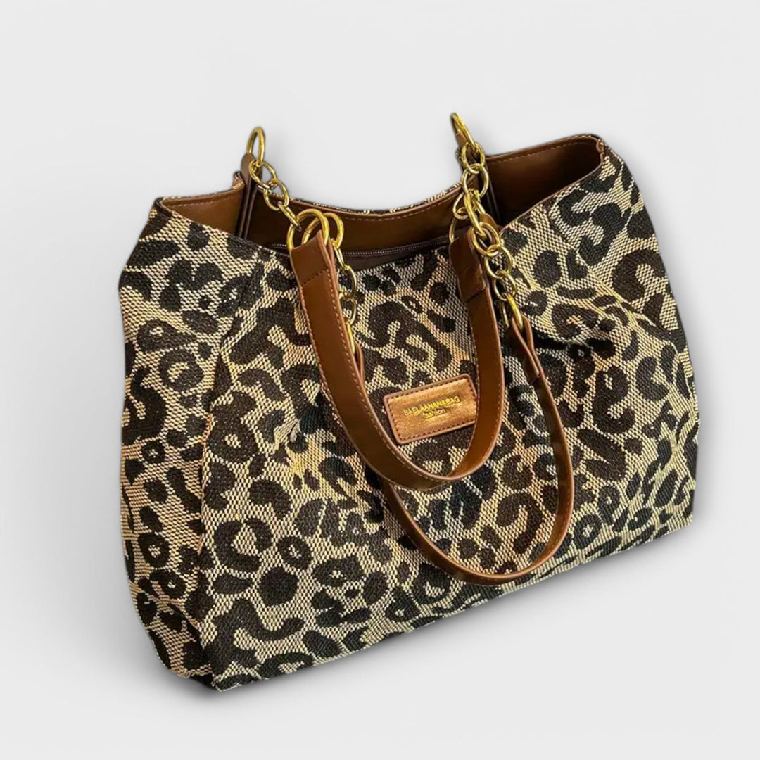 Stylish women's leopard print canvas tote bag, perfect as a shoulder or crossbody everyday fashion accessory.