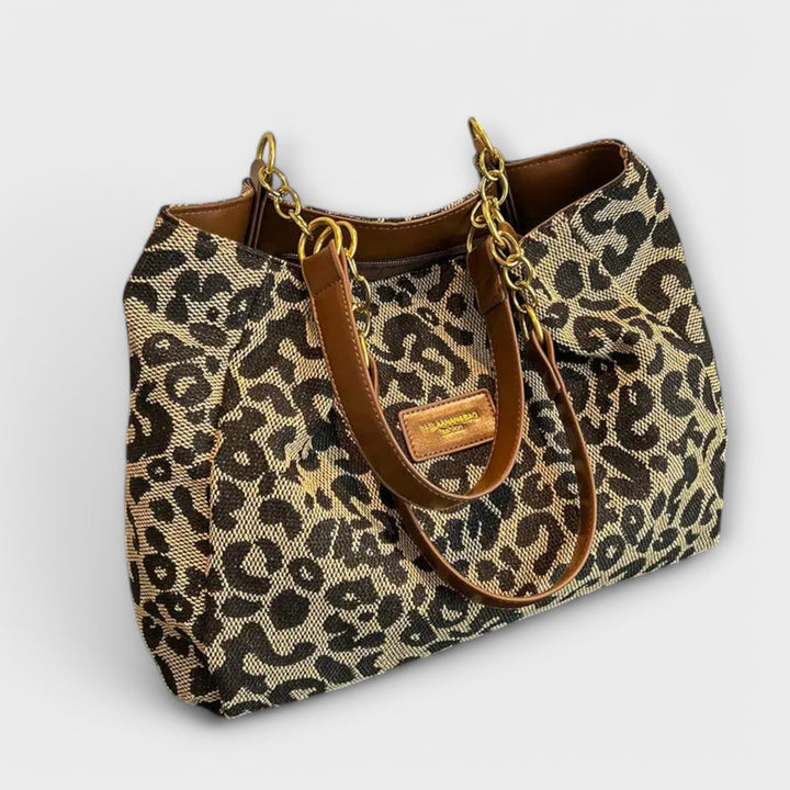 Stylish women's leopard print canvas tote bag, perfect as a shoulder or crossbody everyday fashion accessory.