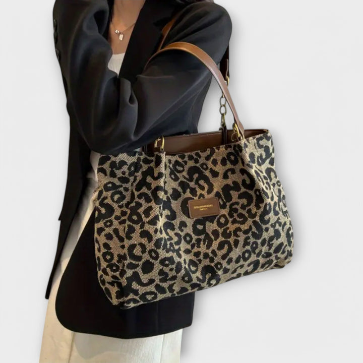 Leopard print canvas tote bag for women, versatile as a shoulder or crossbody bag for daily essentials.