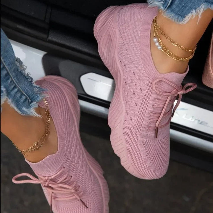 Stylish women's lightweight sneakers with breathable mesh, ideal for casual wear, walking, or light athletic activities.