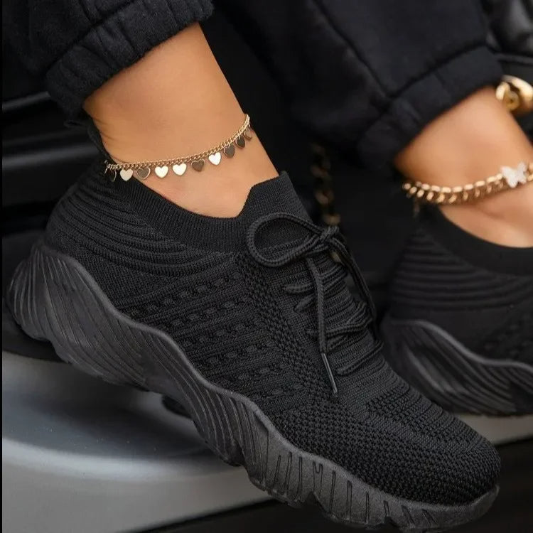 Breathable women's athletic sneakers, lightweight and stylish, offering comfort for walking and casual daily activities.