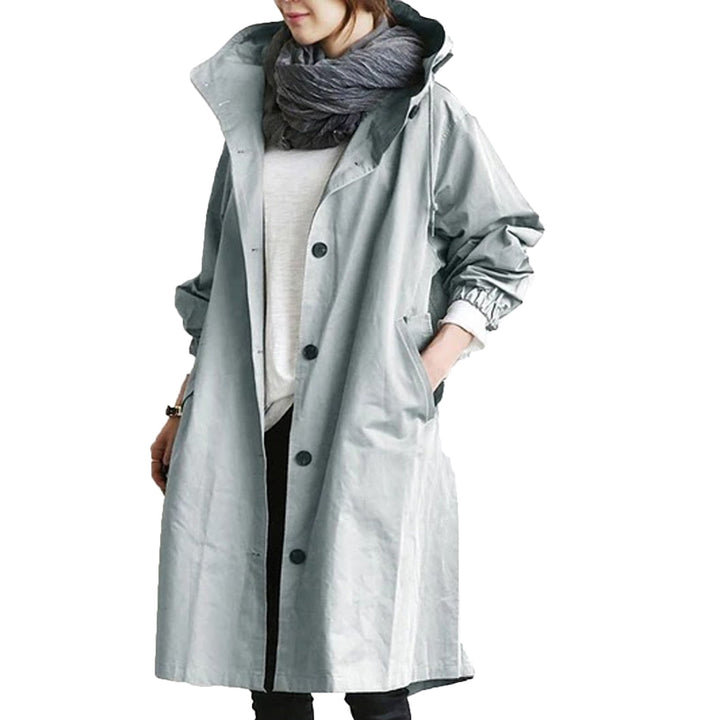 Elegant women's long waterproof raincoat in a sleek design, offering durable all-weather protection.