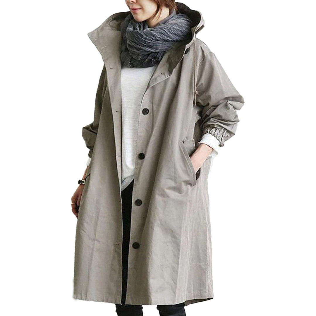 Women's protective long waterproof raincoat for spring/summer, featuring an adjustable hood & chic style.