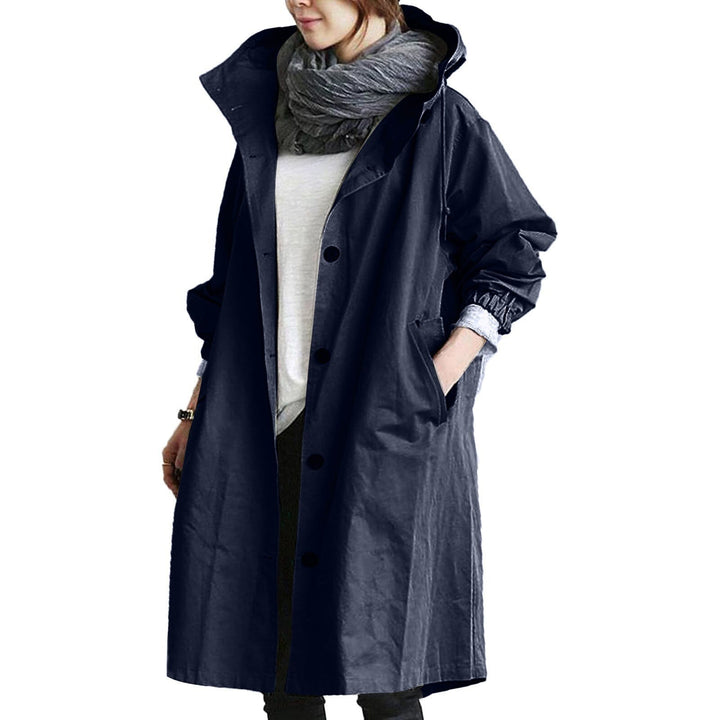 Fashionable women's long water-resistant raincoat; a chic, protective outerwear essential for all weather.