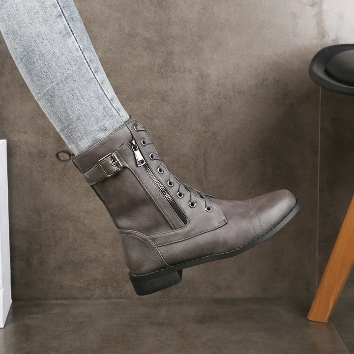 Fashionable mid-calf lace-up boots for women with a chic ankle strap. Ideal for fall & winter outfits.