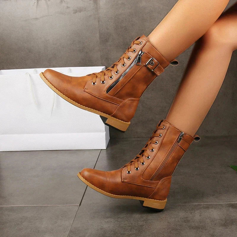 Women's mid-calf lace-up fashion boots featuring a convenient side zipper. Stylish & comfortable for winter.