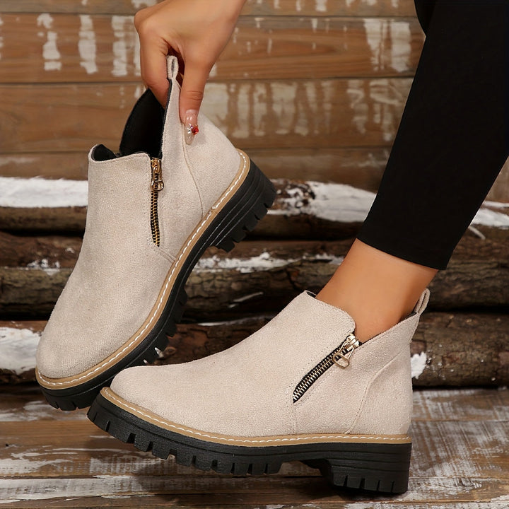 Comfortable & stylish women's orthopaedic ankle boots with arch support for everyday footwear.