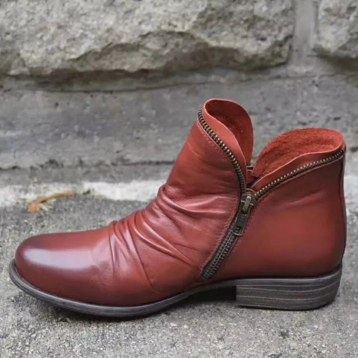 Supportive women's casual ankle boots featuring orthopaedic arch support for all-day walking comfort.