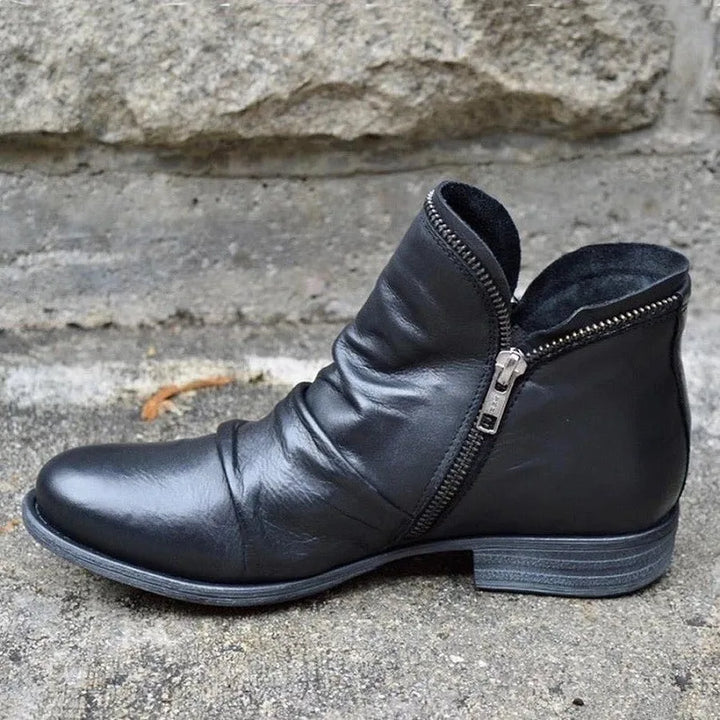 Chic women's orthopaedic ankle boots designed with arch support, blending style and foot health.