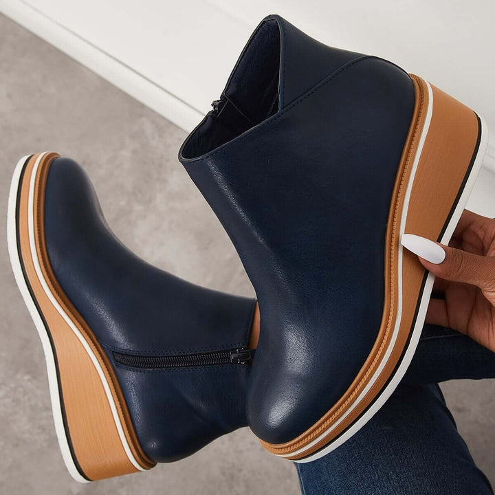 Elegant women's orthopedic ankle boots, blending fashion with essential foot support.