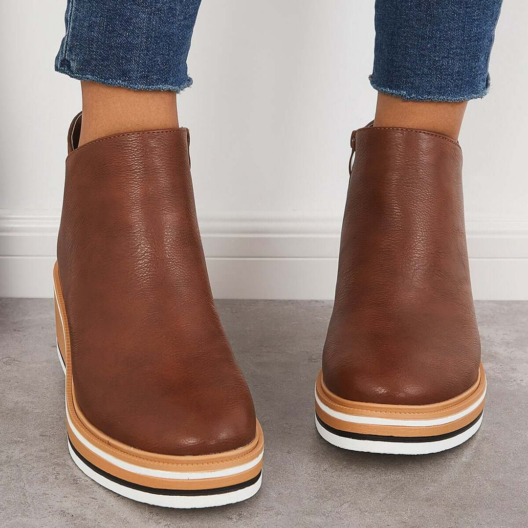 Women's platform orthopedic ankle boots, designed for fashion, comfort, and support.