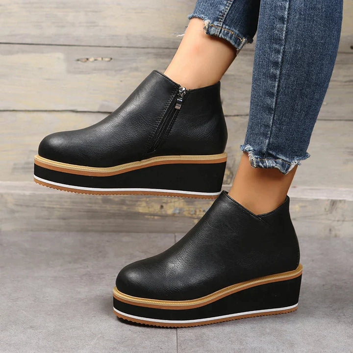 Sleek women's orthopedic dress boots, providing supportive and comfortable fashion footwear.