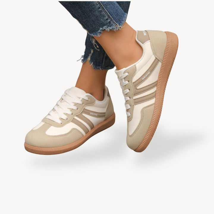 Stylish women's orthopedic sneakers with contrast accents, providing comfort & support for everyday wear.