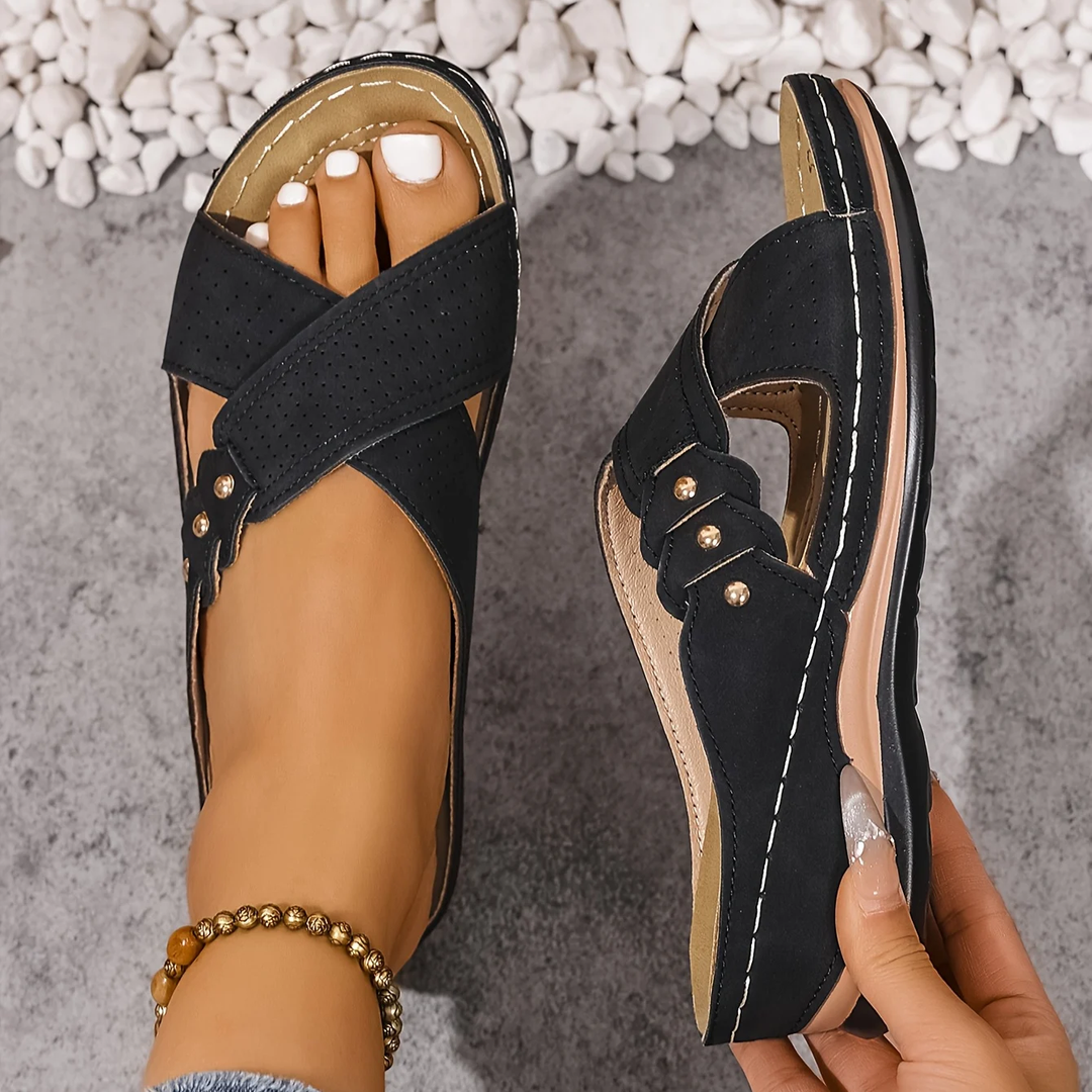Top view of stylish women's orthopedic wedge sandals with comfortable straps and arch-supportive footbed.