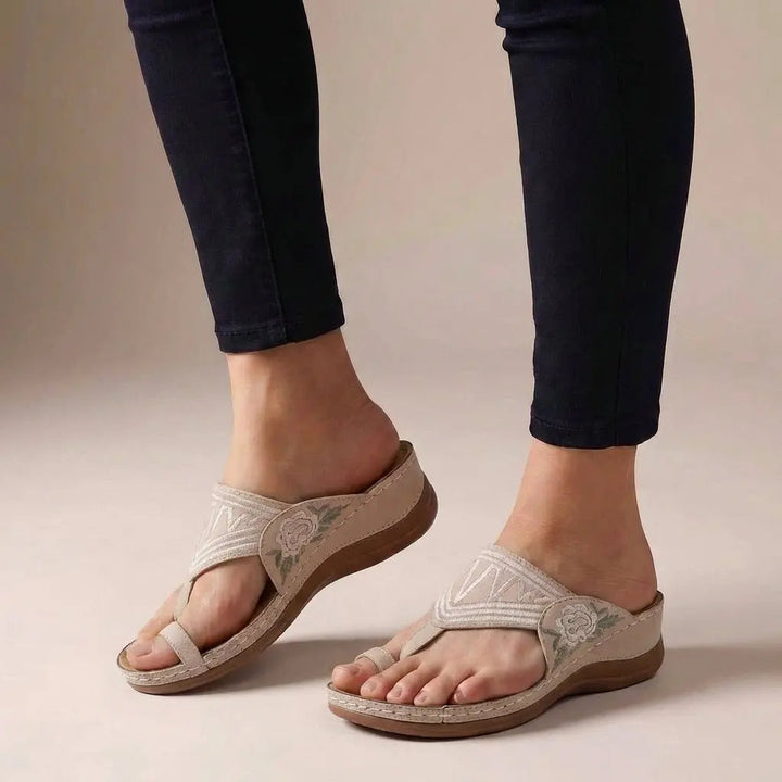 Comfort-focused women's orthopedic wedge sandals, thong style, with beautiful floral embroidery. Ideal for walk support.