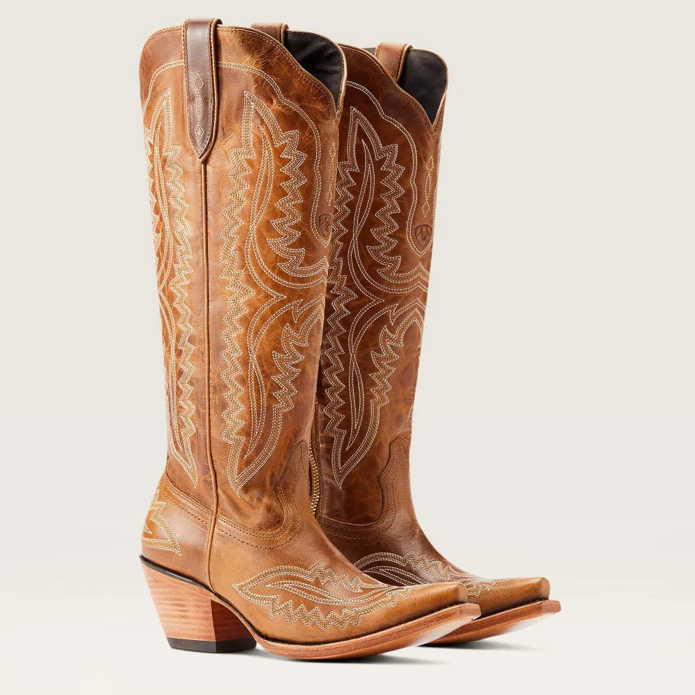Studio shot of women's patterned zipped tall boots. Features stacked heel, pointed toe, elegant fashion.