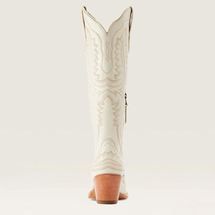 Women's patterned knee-high boots with stacked heel outdoors. Stylish zip boots for all-season casual wear.