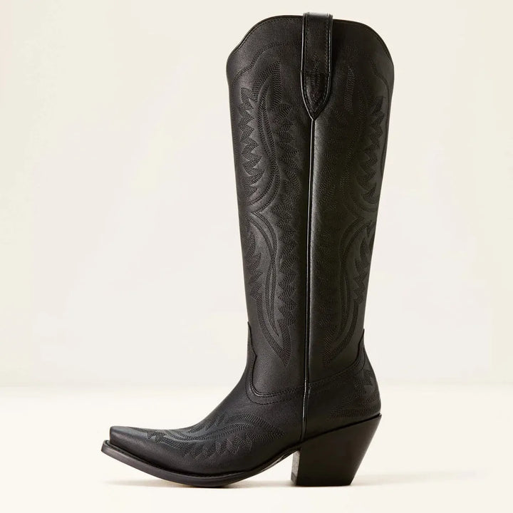 Rich textured pattern on women's tall boots. Features zip closure, stacked heel, and pointed toe for style.