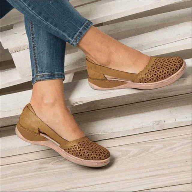 Women's perforated wedge cutout sandals, comfortable slip-on summer footwear. Ideal for casual fashion.