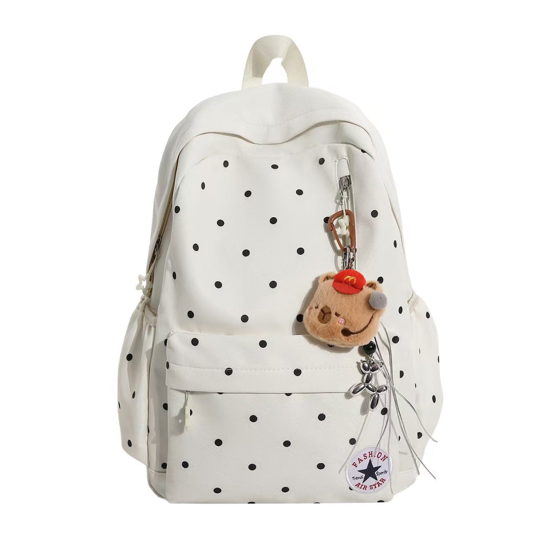 Stylish women's polka dot backpack with embellishments, perfect for school, daily carry & travel.