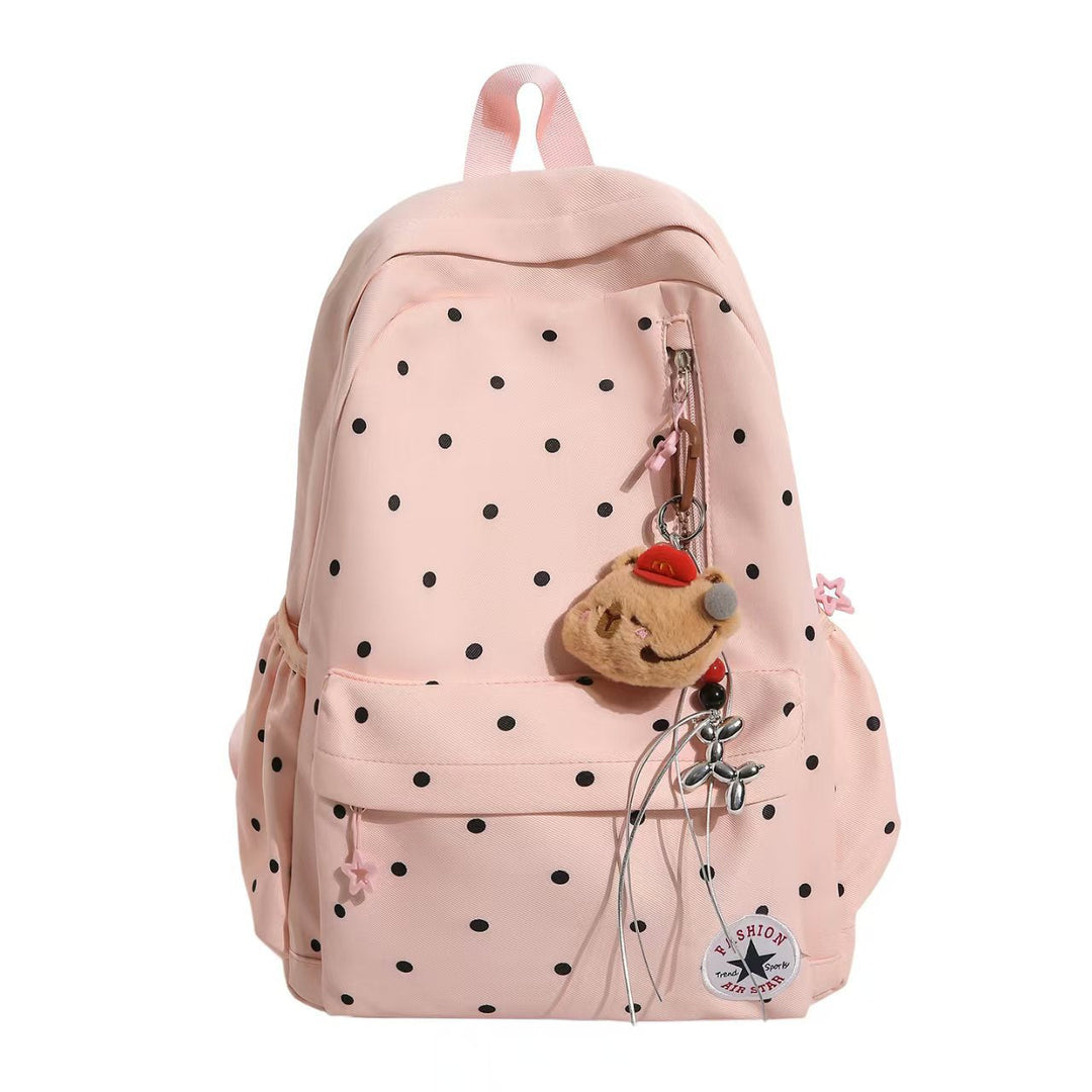 Fashionable women's embellished polka dot backpack. A chic accessory for students & daily carry.
