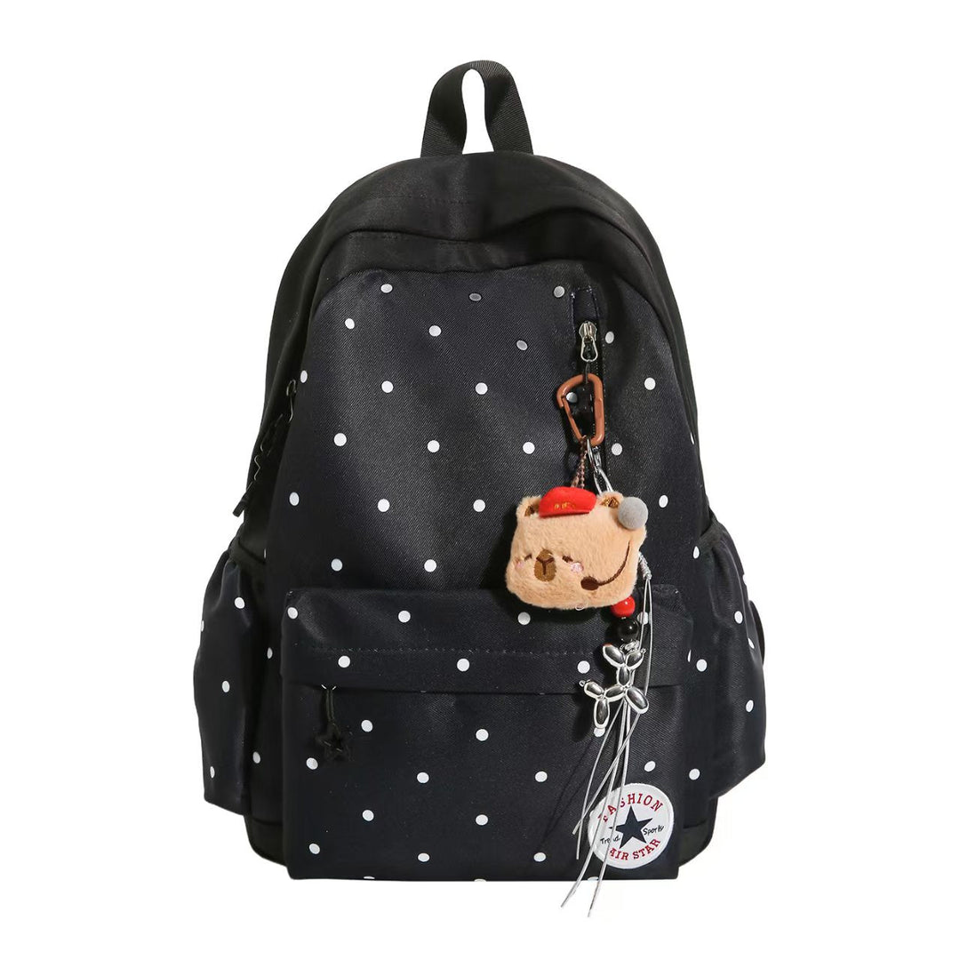 Elegant women's polka dot embellished backpack, versatile as a school bag or casual daily carry.