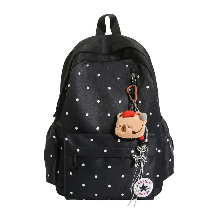 Elegant women's polka dot embellished backpack, versatile as a school bag or casual daily carry.