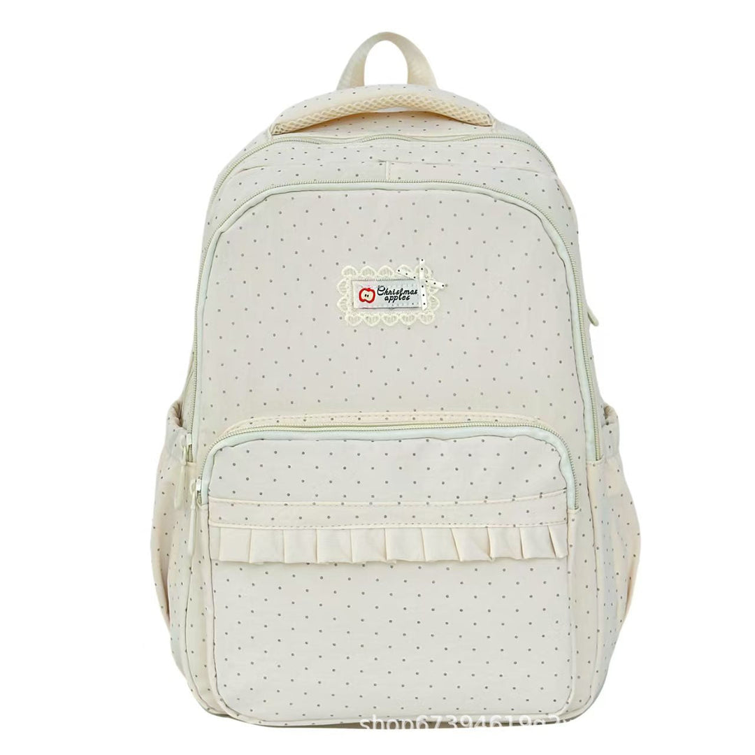 Stylish women's polka dot ruffled backpack, a chic fashion accessory for school, travel & casual wear.