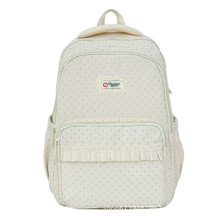 Stylish women's polka dot ruffled backpack, a chic fashion accessory for school, travel & casual wear.