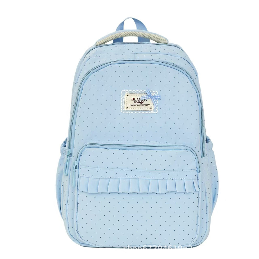 Casual women's polka dot backpack with ruffles, great for school, daily use, or as a lightweight travel bag.