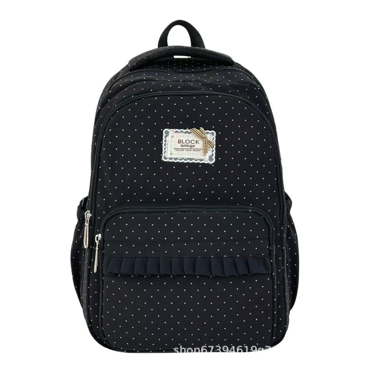 Back of a women's polka dot ruffled backpack, featuring comfy adjustable straps & a spacious interior for travel or school.