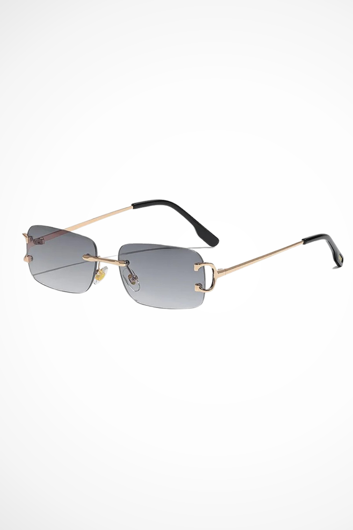 Chic women's rimless rectangular sunglasses with modern tinted lenses and slender gold frames for stylish looks.