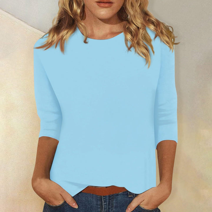 Chic women's round neck quarter sleeve top. Enjoy its effortless style for summer & casual everyday wear.