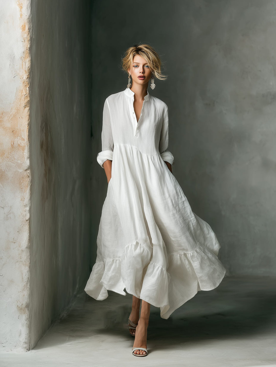 Full length view of a versatile women's long sleeve maxi shirt dress with a chic ruffle hem and button front.