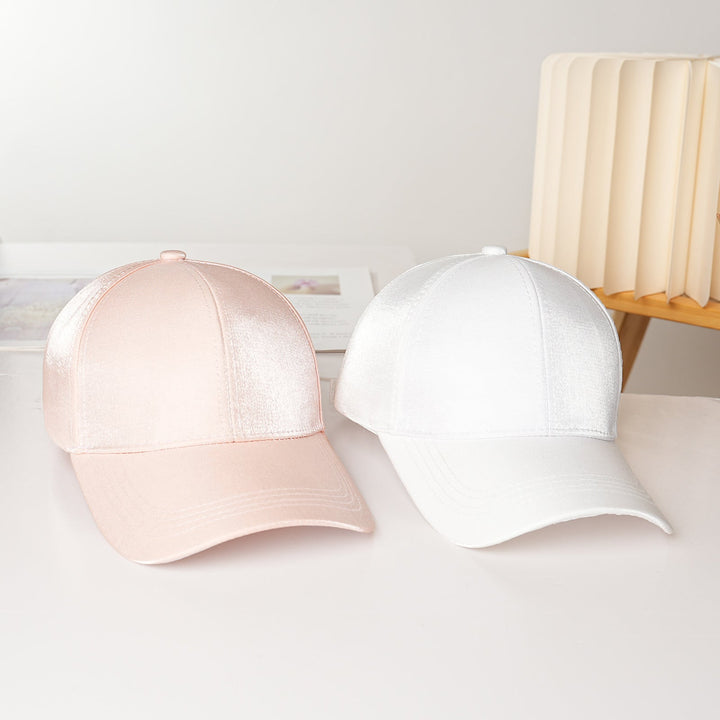 Women's sleek satin baseball cap, an adjustable and fashionable summer hat for modern style.
