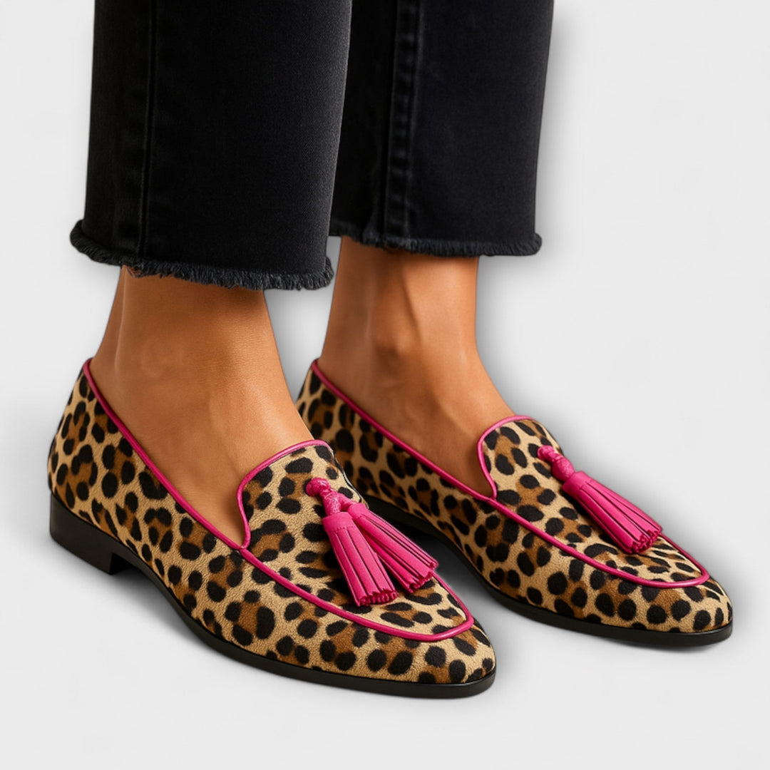 Stylish women's slip-on loafers with playful tassel accents & trendy animal print, perfect for comfortable everyday wear.