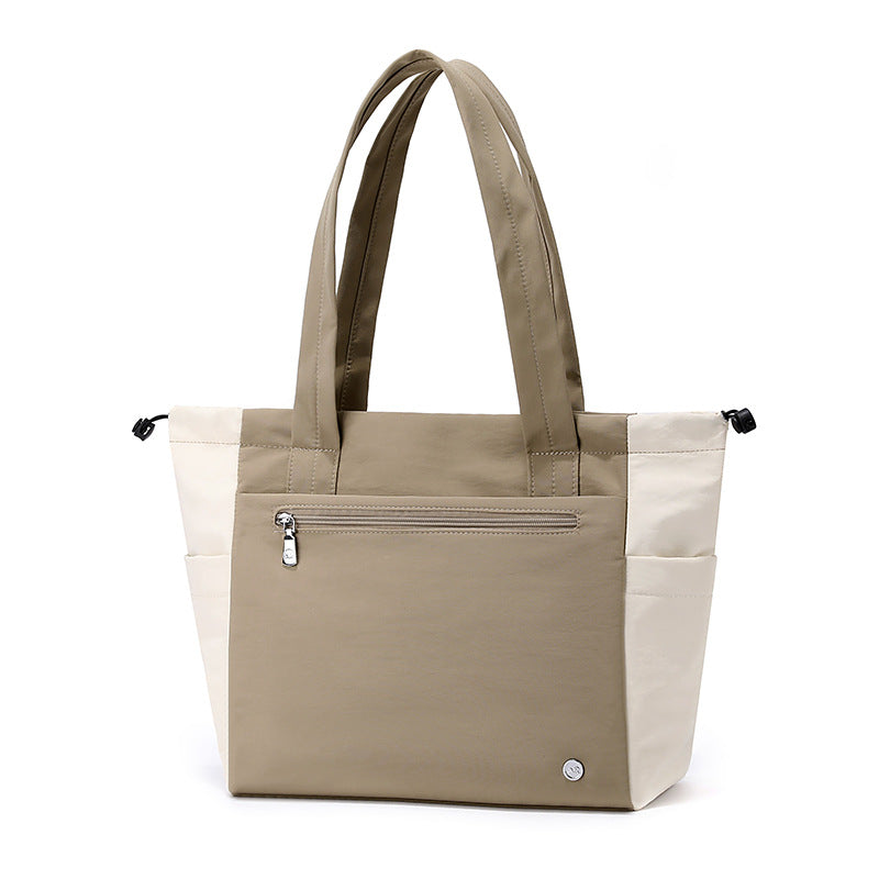 Stylish women's spacious tote bag in a versatile color, perfect as a daily work or travel shoulder bag.