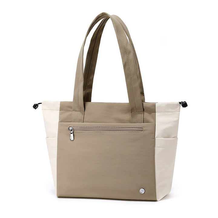 Stylish women's spacious tote bag in a versatile color, perfect as a daily work or travel shoulder bag.