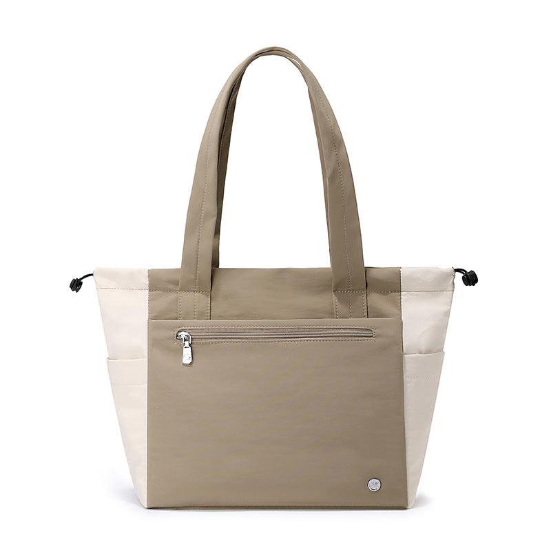 Chic women's large tote bag, a versatile shoulder handbag perfect for work commutes or travel adventures.