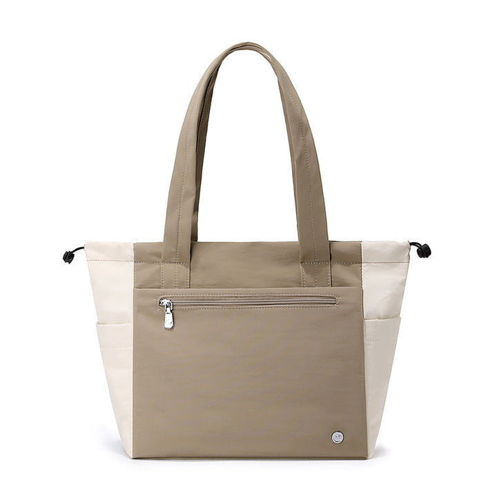 Chic women's large tote bag, a versatile shoulder handbag perfect for work commutes or travel adventures.