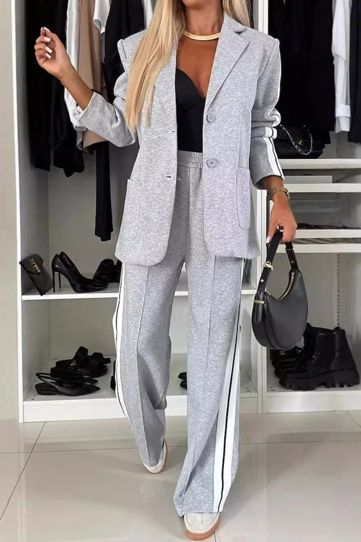 Stylish women's striped blazer & wide-leg pant two-piece set for a chic office or casual look. Trendy matching outfit.