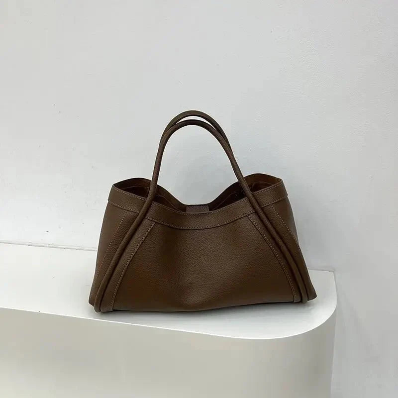 Chic women's minimalist tote bag with a structured silhouette, designed for fashion-conscious women.