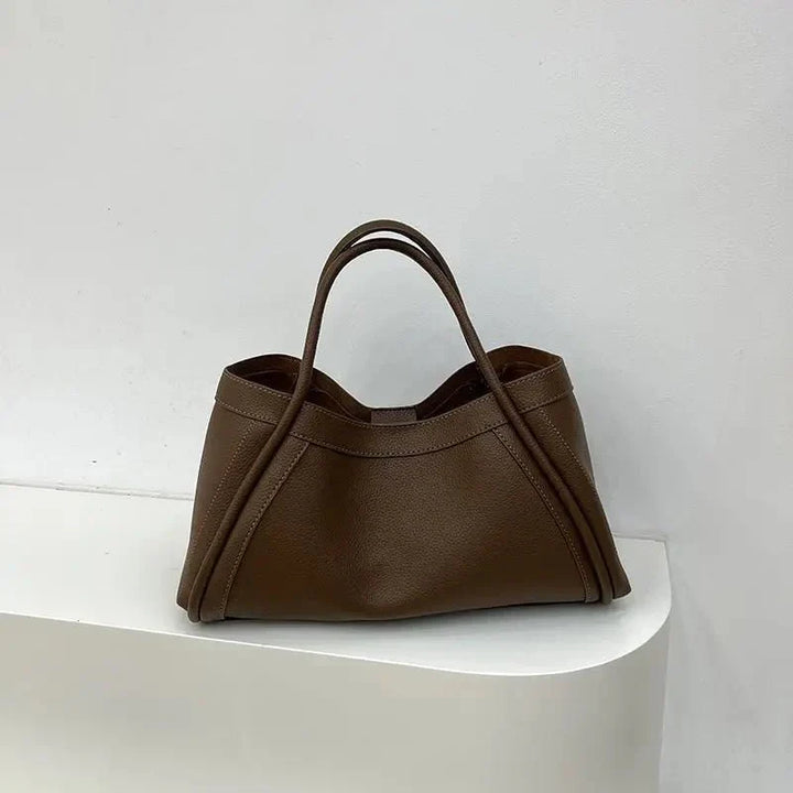 Chic women's minimalist tote bag with a structured silhouette, designed for fashion-conscious women.